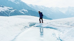 Man walking across an ice flow